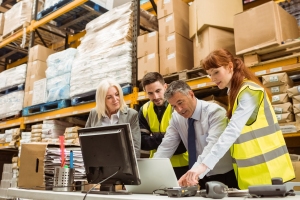 Warehouse Managers Checking Performance of Short Term Workers