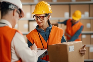 Warehouse Workers Preparing Order Shipment with Accuracy